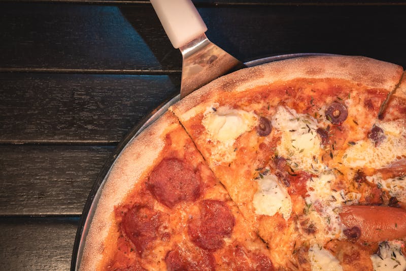 BBQ Chicken mods pizza with caramelized onions and cilantro